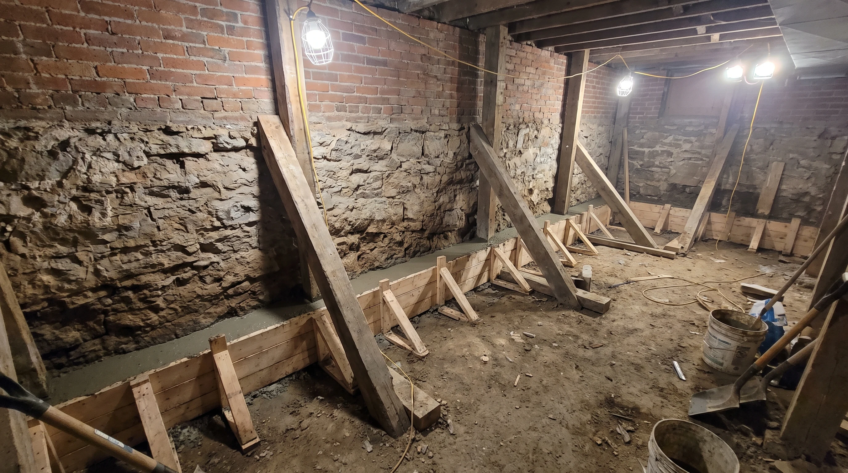 Basement underpinning formwork during a Westdale Hamilton project